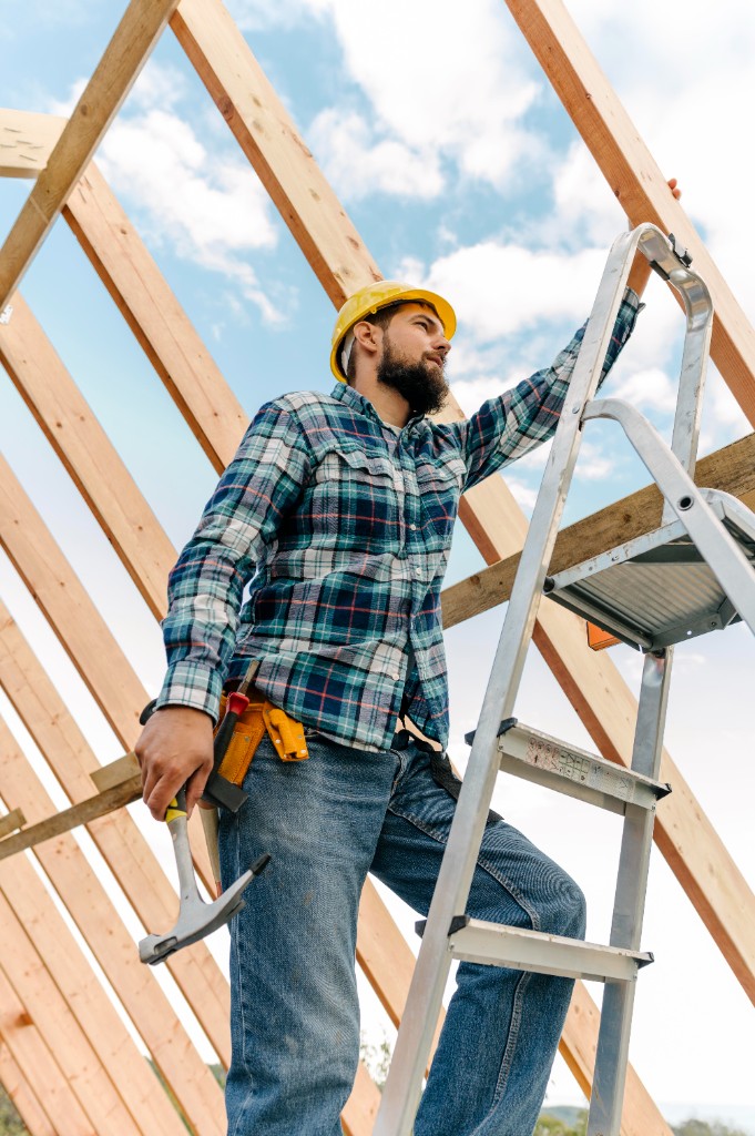 Builder working on framing structure